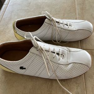 Lacoste tennis shoes white with yellow trim. Size 8